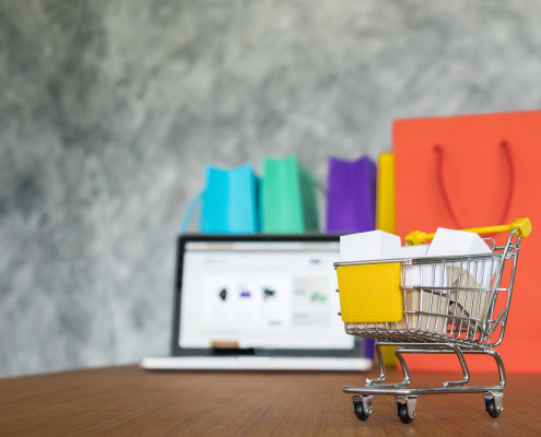 laptop and shopping bags, online shopping concept
